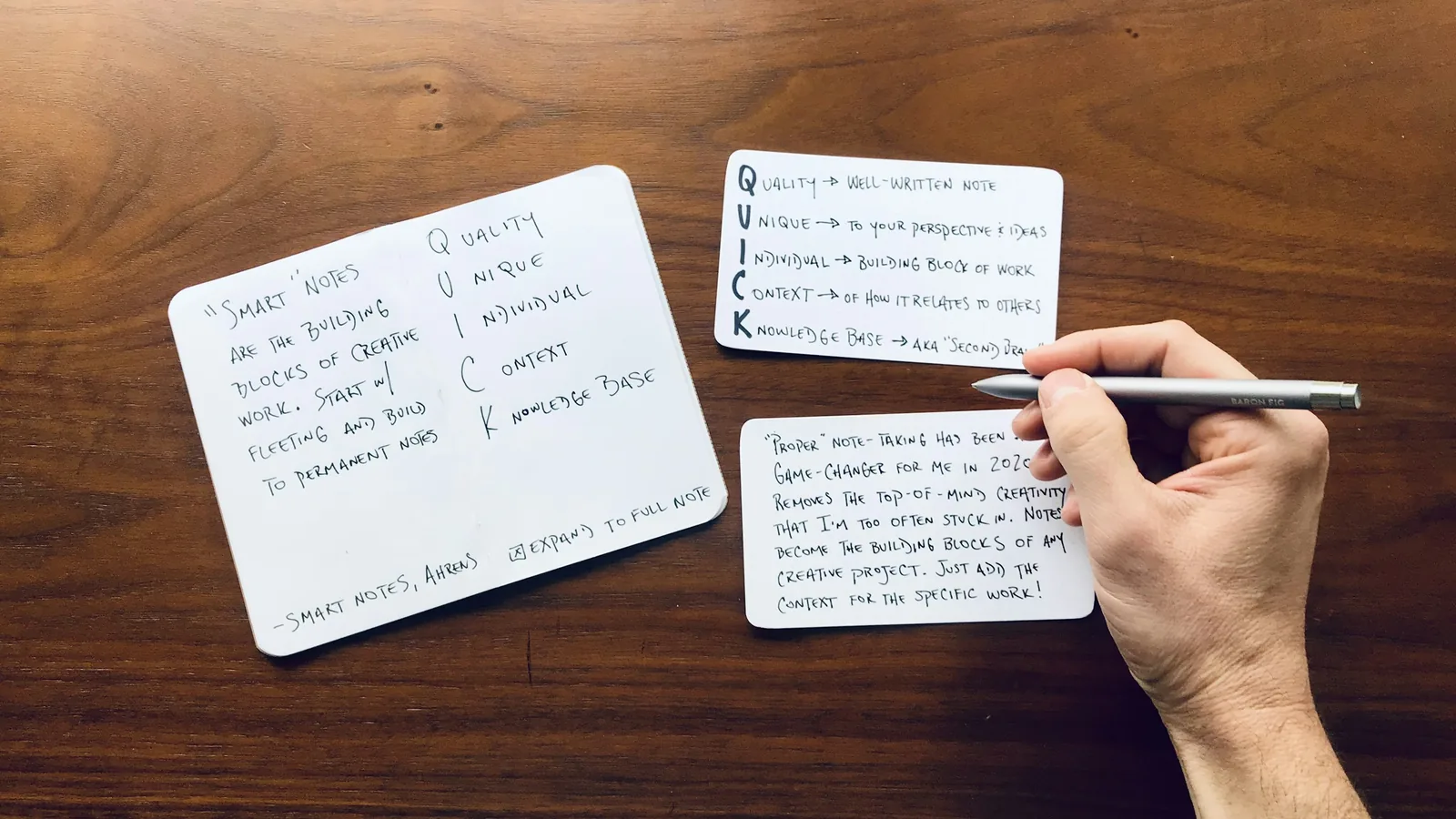 Handwritten cards on a table listing the rules the team agreed on